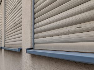 closed windows roller shutters on a house closed windows roller shutters